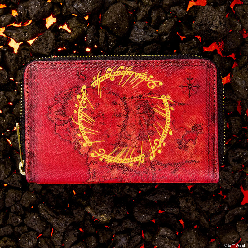 Loungefly Lord of the Rings zip around wallet featuring a map of Middle Earth against a red background. The wallet sits against a background of glowing rocks. 